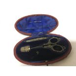 A cased silver sewing set with thimble Chester hal