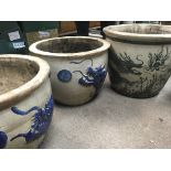 Three large planters decorated with dragons