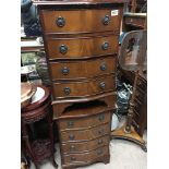 A pair of mahogany small flights of drawers each f