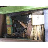 A box of antique woodworking tools including rule’