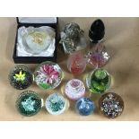 A collection of paperweights including a boxed Cai