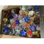 A large collection of paperweights, different size
