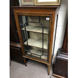 An Edwardian inlaid display cabinet.