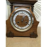 A walnut Enfield mantel clock with Roman numerals.