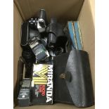 A box of camera equipment and accessories.