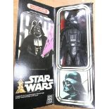 A boxed 12" Darth Vader figure.