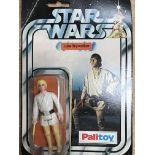 A early carded Luke Skywalker figure. Blister has