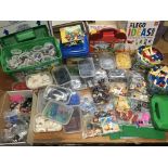 Four boxes containing a large collection of loose Lego with some instructions and sets, including