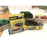 A collection of various die cast cars including a