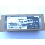 A boxed Tin Plate Ford County Sedan.