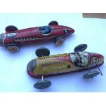 2 clockwork racing cars.(2)