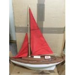 A vintage plastic pond yacht.