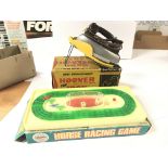 A Zodiac toys horse racing game and a toy Iron. Bo