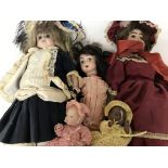 A collection of five dolls with bisque heads - NO