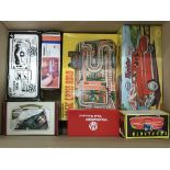 A collection of boxed tin plate toy cars including a Minister American Car, an Ambulance, a