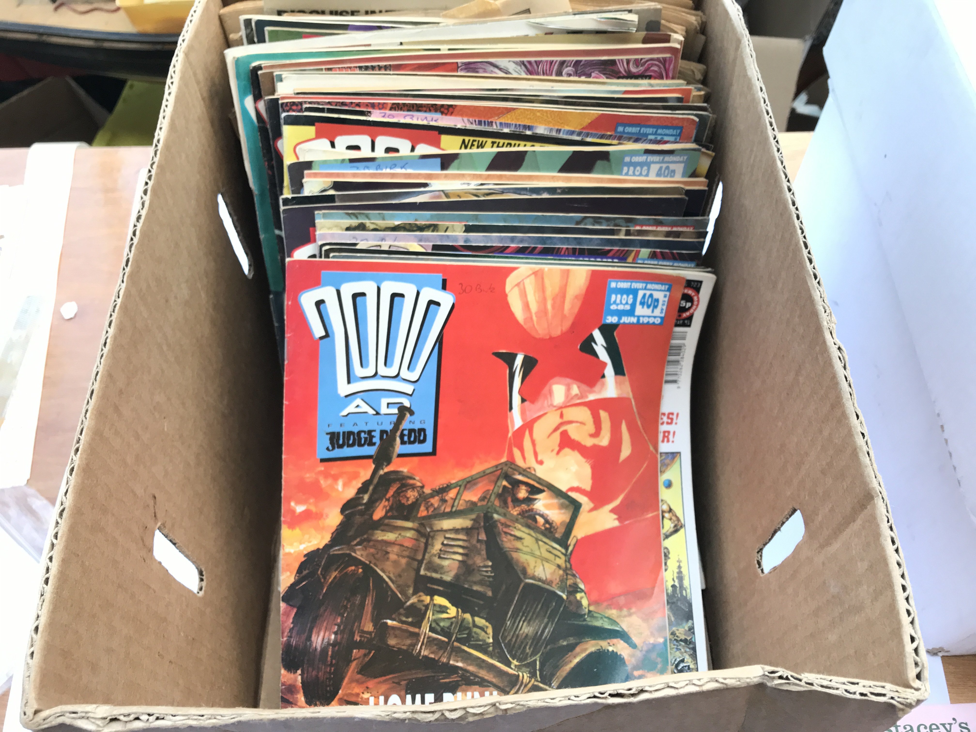 A box containing a collection of 200 ad comics