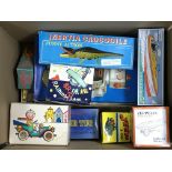 A box containing various reproduction boxed tin plate toys including a battery operated Space Walk