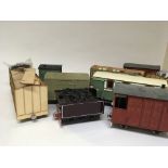 A collection of gauge one carriages and goods wago