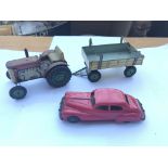 A tri-ang clockwork car,tractor and trailer.