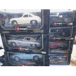 A collection of Burago boxed cars. (8)