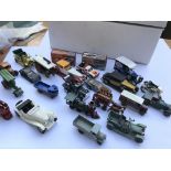 A collection of various toy cars and two boxed Mat