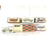 A collection of boxed cars etc.