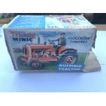 A Tri-ang Minic boxed clockwork Tractor.