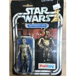 A carded Star Wars C-3po figure, blister is half o