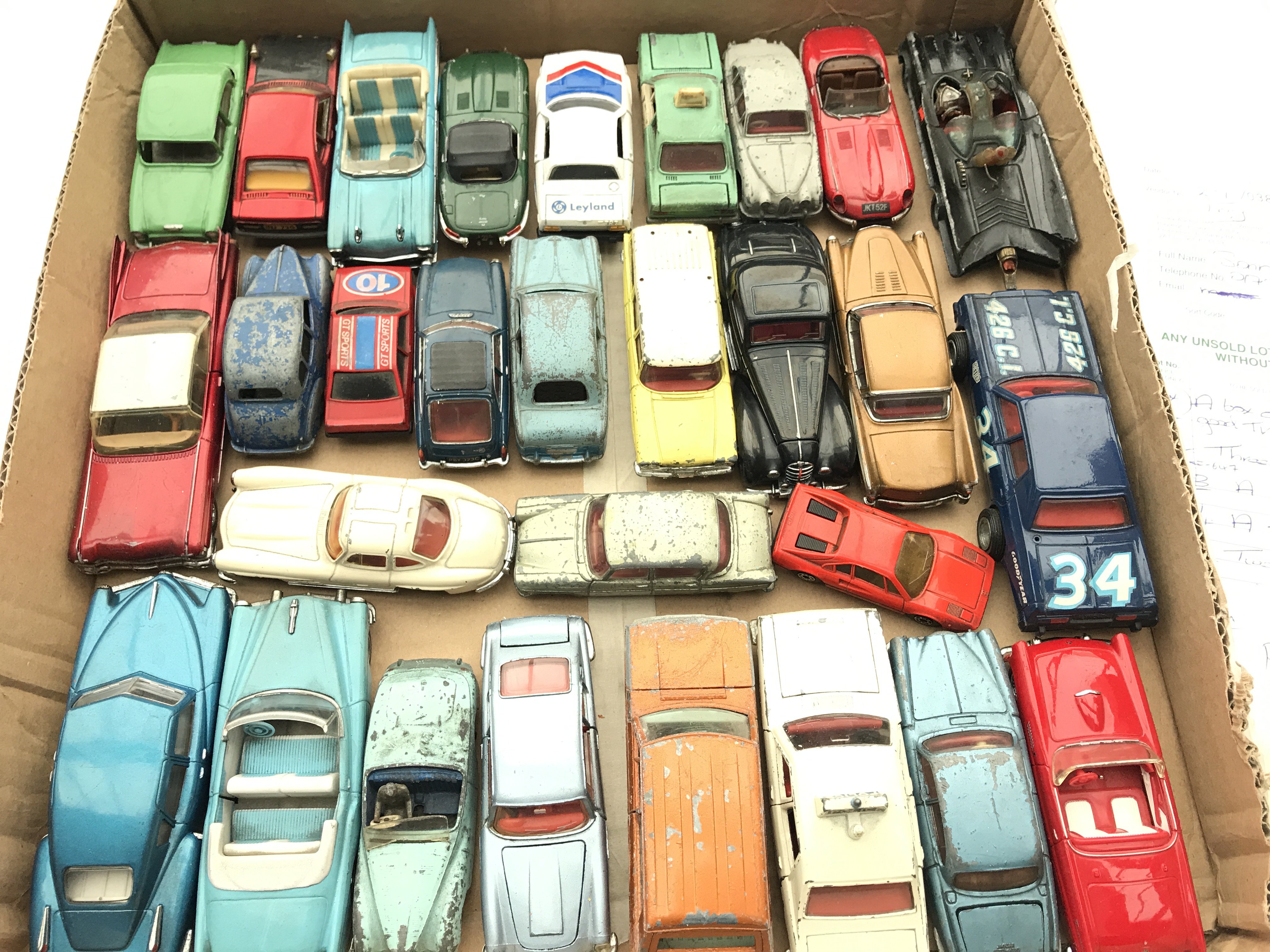 A collection of Playworn Dinky cars.