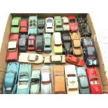 A collection of Playworn Dinky cars.