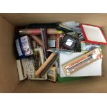 A box containing a collection of Train set Theming, including rolling stock,dvds, circuits,