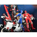 A collection of Power Rangers toys.