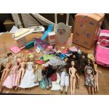 A collection of loose Barbie dolls , with a collec