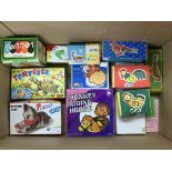 A box containing a collection of boxed tin plate animals including a Monkey Riding a Horse, a