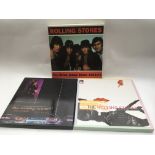 Three Rolling Stones 12x12 CD box sets.