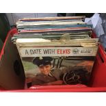 A collection of Elvis Presley LPs.