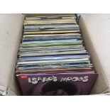 A box of LPs and 12 inch singles by various artist