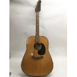 An Antoria acoustic guitar. Comes supplied with a