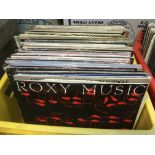 A box of LPs and 12 inch singles by various artist