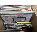 A box of various LPs, 12 inch and. 7 inch singles,