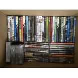 Two boxes of DVDs, various films, tv series and music, some still sealed.