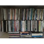 A collection of over 100 CDs by various artists in