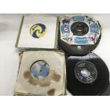 A small collection of 7 inch singles by various ar