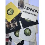 A collection of Beatles and solo 7" records.