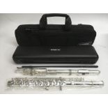 A cased and as new Yamaha flute.