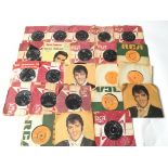 A record box containing Elvis Presley 7inch single