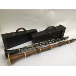 A cased 19th Century boxwood clarinet by and stamp