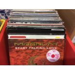 A box of LPs and 12 inch singles by various artist