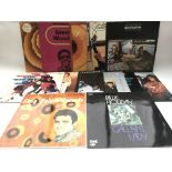 A collection of LPs by various artists including B