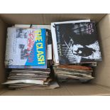 A box if 7 inch singles by various artists includi